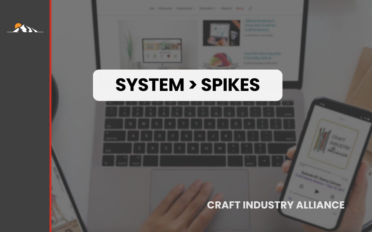 System spikes concept: laptop keyboard and smartphone in modern digital workspace.